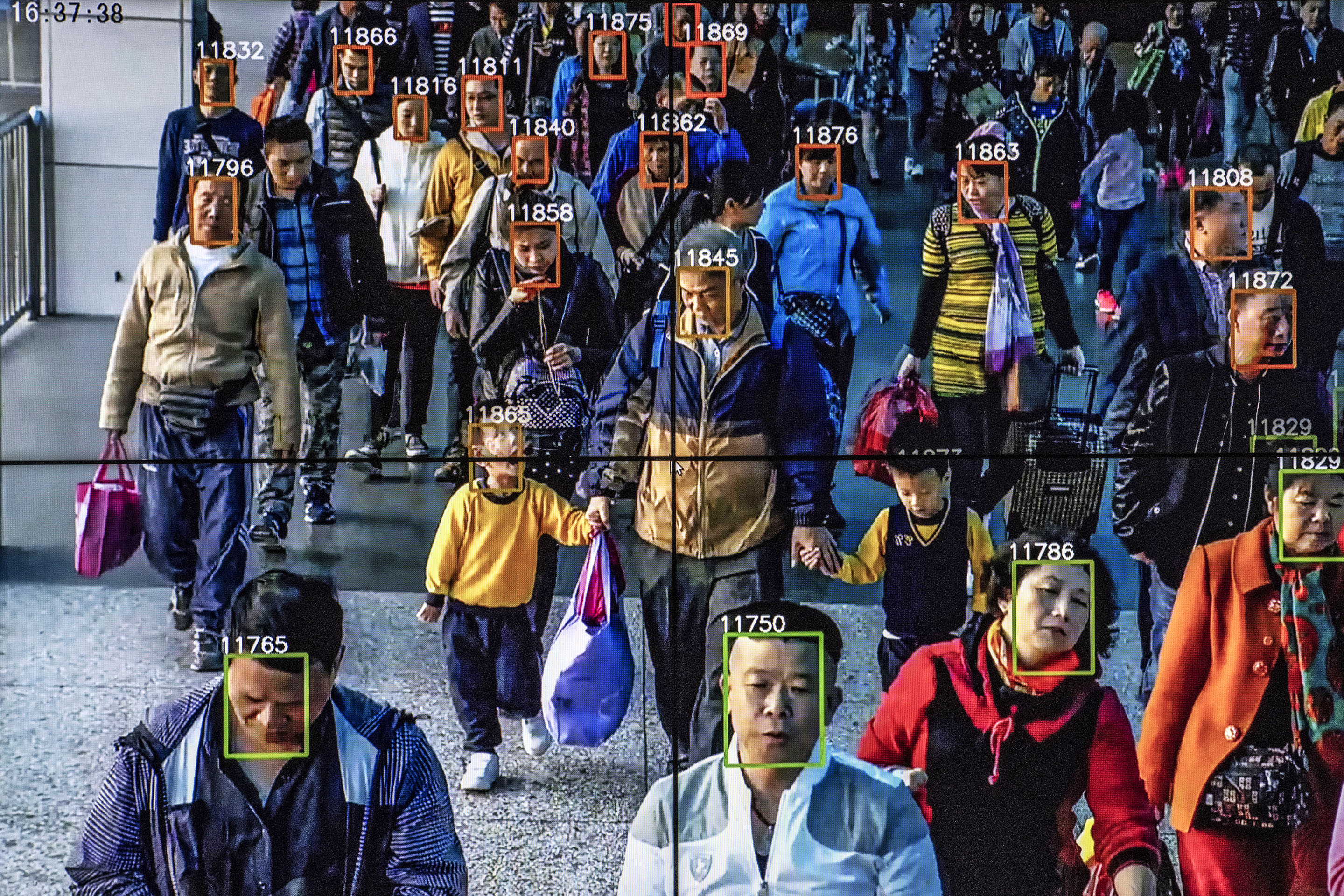 Monitors display a video showing facial recognition software in use at the headquarters of the artificial intelligence company Megvii, in Beijing.